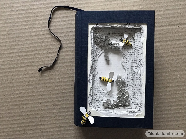 Livre réutilisé. Ruche dans un livre, abeilles en papier