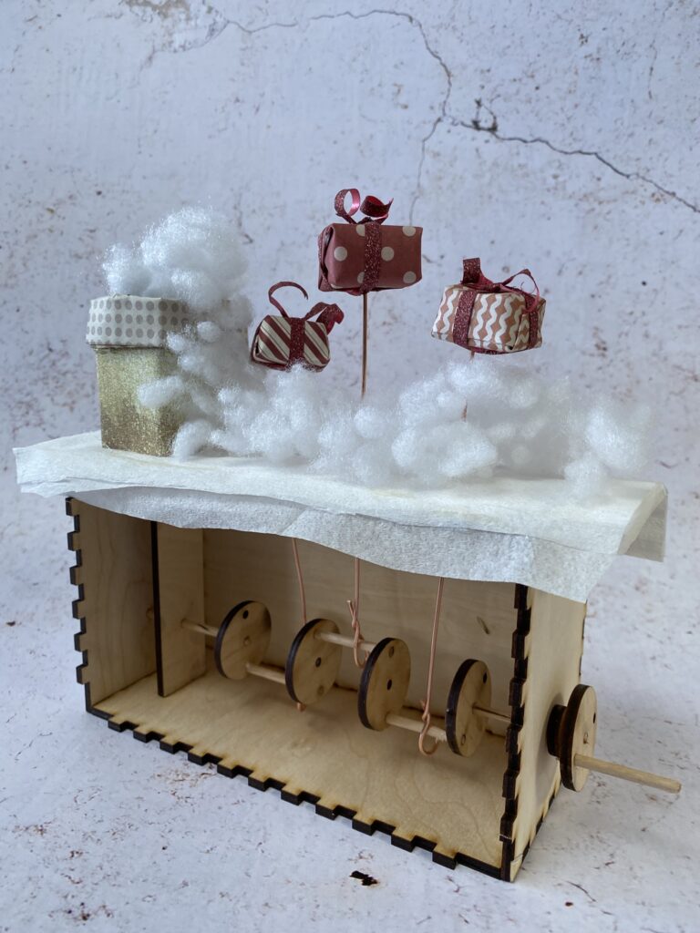 La cheminée du père noël en calendrier de l'avent 22 automate de noel : cheminée et 3 mini-cadeaux qui volent